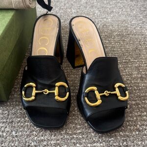 Gucci Black Mules with Gold Hardware